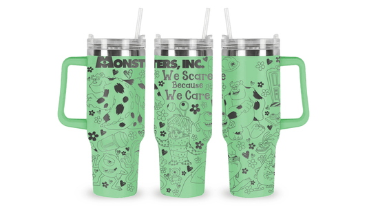 Stainless steel mug with an engraved Monsters, Inc. design, featuring Sulley, Mike Wazowski, and factory-themed details.