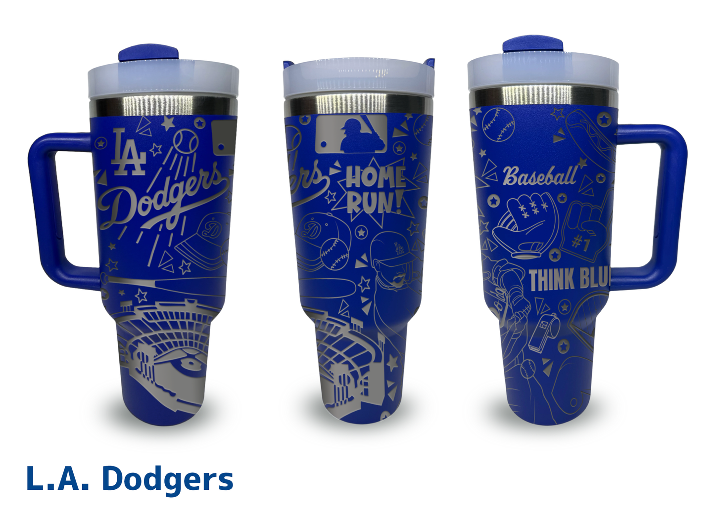 A set of three blue 40oz engraved tumblers featuring a Los Angeles Dodgers baseball theme. The tumblers have intricate silver engravings, including the "Dodgers" logo, baseball-related illustrations such as a stadium, bats, gloves, and players, along with phrases like "Home Run!" and "Think Blue." Each tumbler has a handle, a clear lid, and stainless steel accents. The background is plain white, and "L.A. Dodgers" is written in bold blue text below the image.