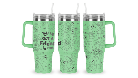 Engraved tumbler featuring Toy Story characters like Woody, Buzz Lightyear, and aliens with playful, starry accents